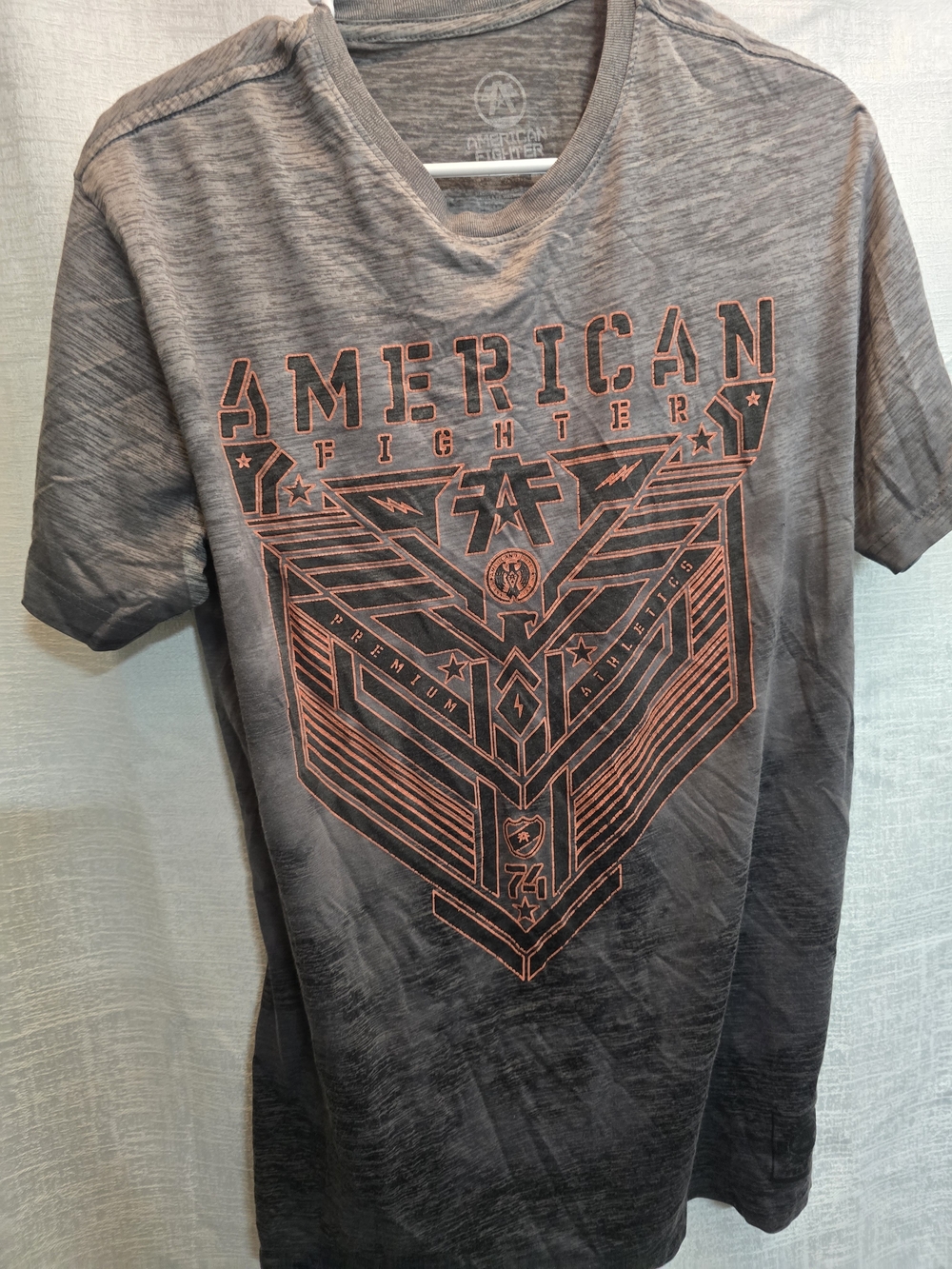 American Fighter Men’s Gray Graphic Tee with Orange Print